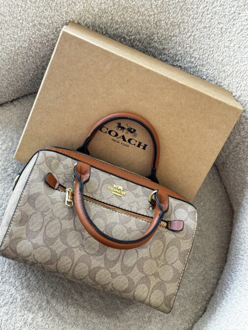 شنطة coach مع إيد طويلة